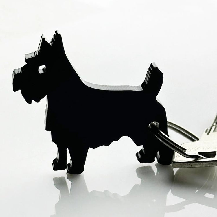 mo man tai - dog keychain